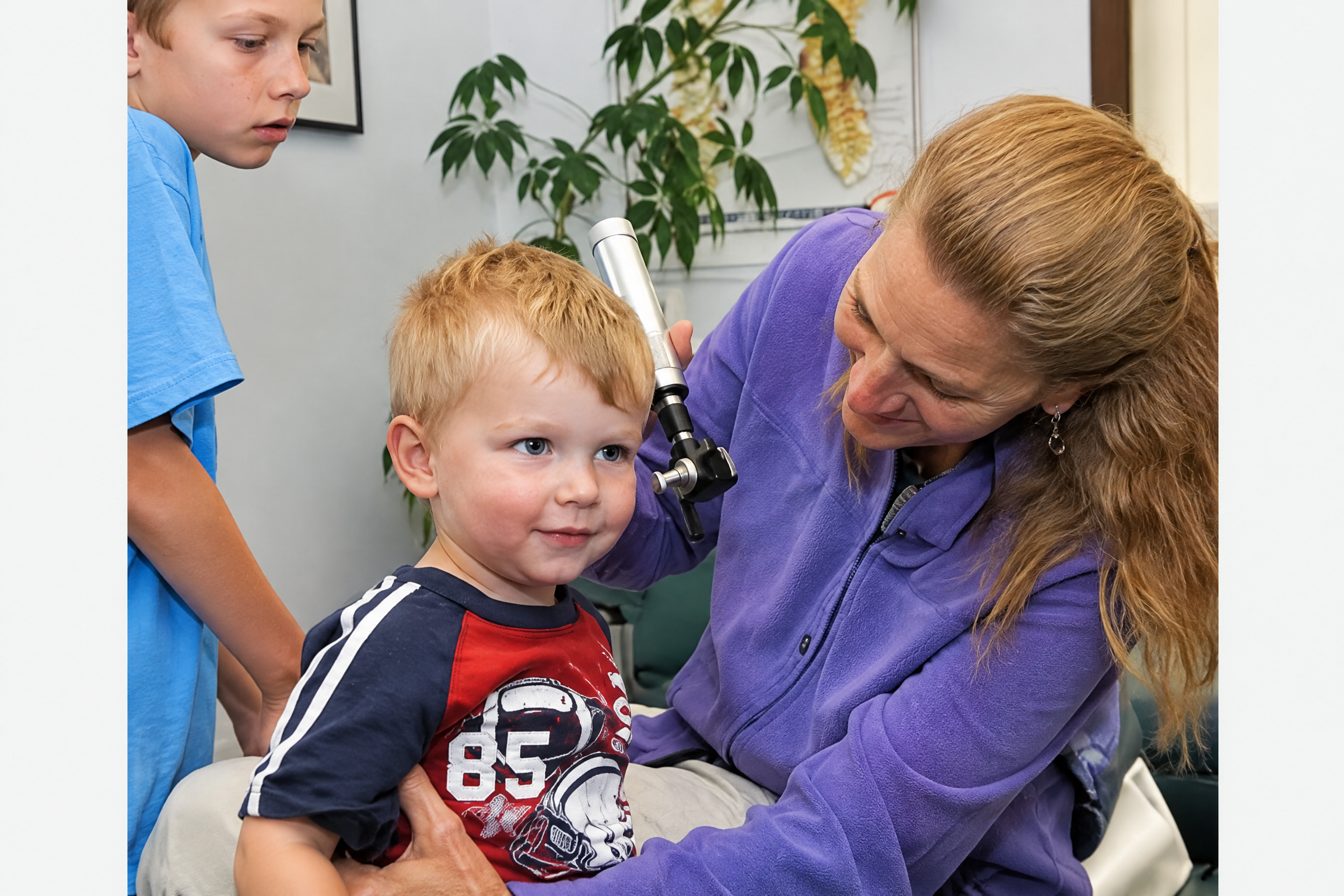 Chiropractor examining a child or infant in the clinic